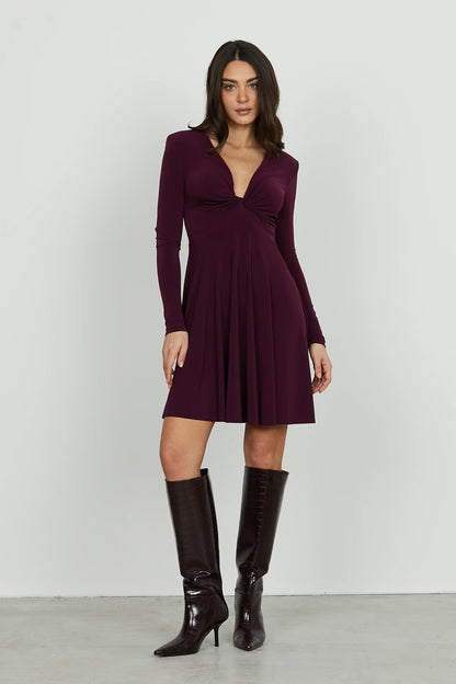 QUIRIMBAS short dress with long sleeves and a V-neckline and a knot