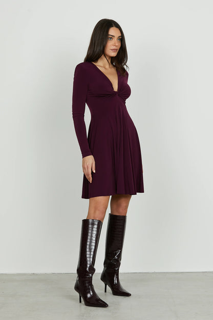 QUIRIMBAS short dress with long sleeves and a V-neckline and a knot