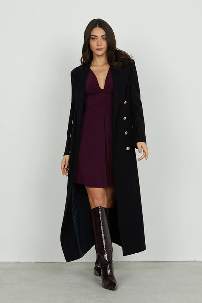 QUIRIMBAS short dress with long sleeves and a V-neckline and a knot